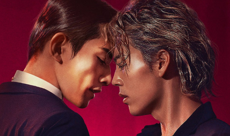 Two individuals sharing an intimate moment in elegant attire