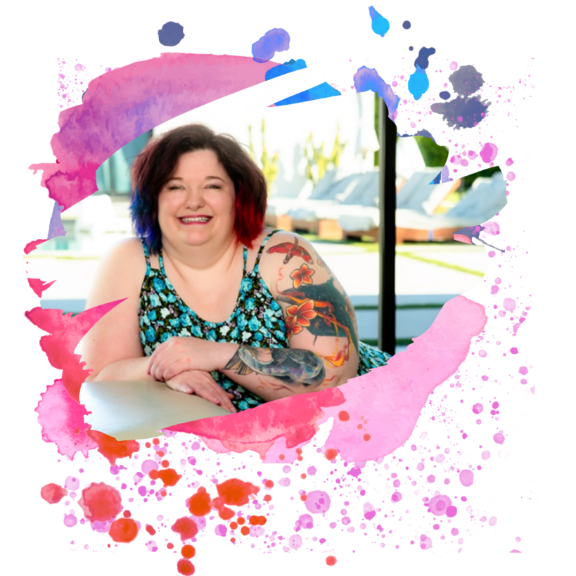 Smiling woman with colorful tattoos and vibrant watercolor design